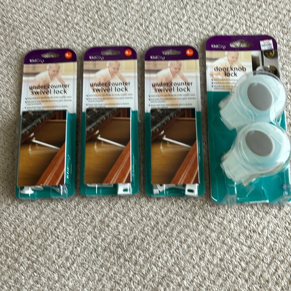 NWT Baby proofing cabinet locks and doorknob locks. 3 sets of 4 locks per pack